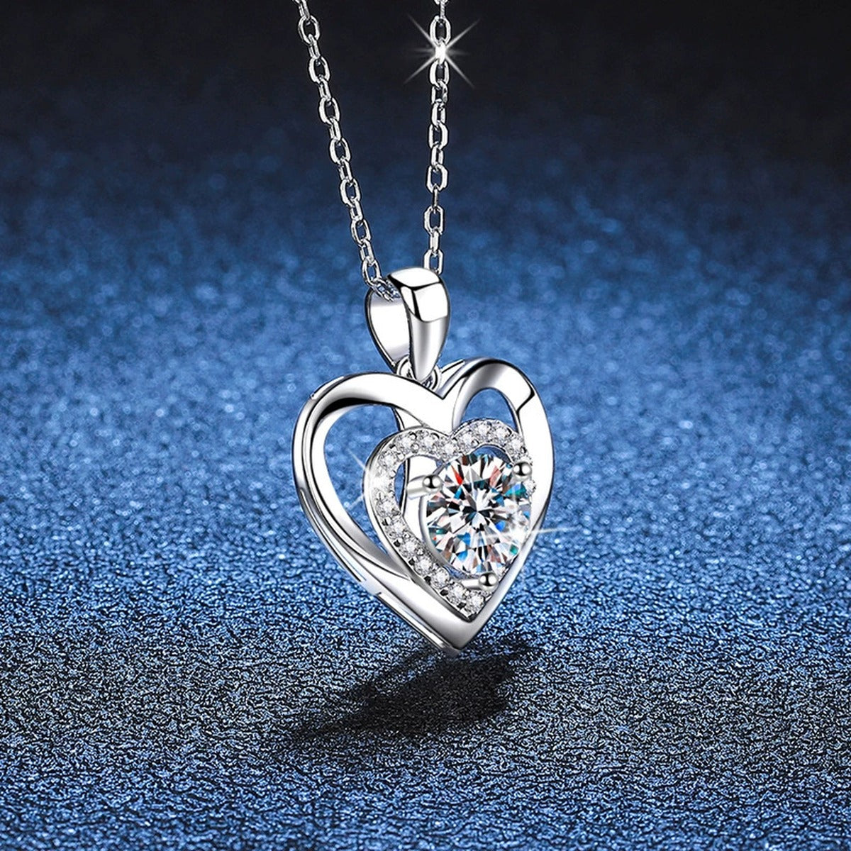 Heart Halo Moissanite Pendant Necklace in Platinum-Plated S925 Sterling Silver blue background close-up view