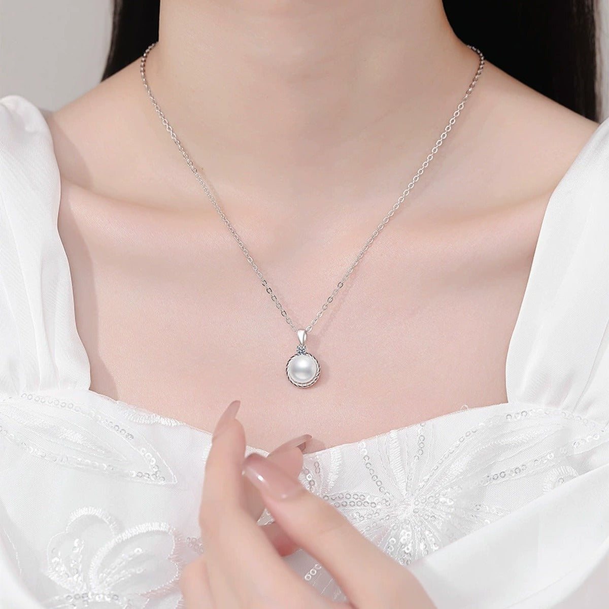 Moissanite Freshwater Pearl Pendant Necklace in White Gold-Plated S925 Sterling Silver worn on neckline by model