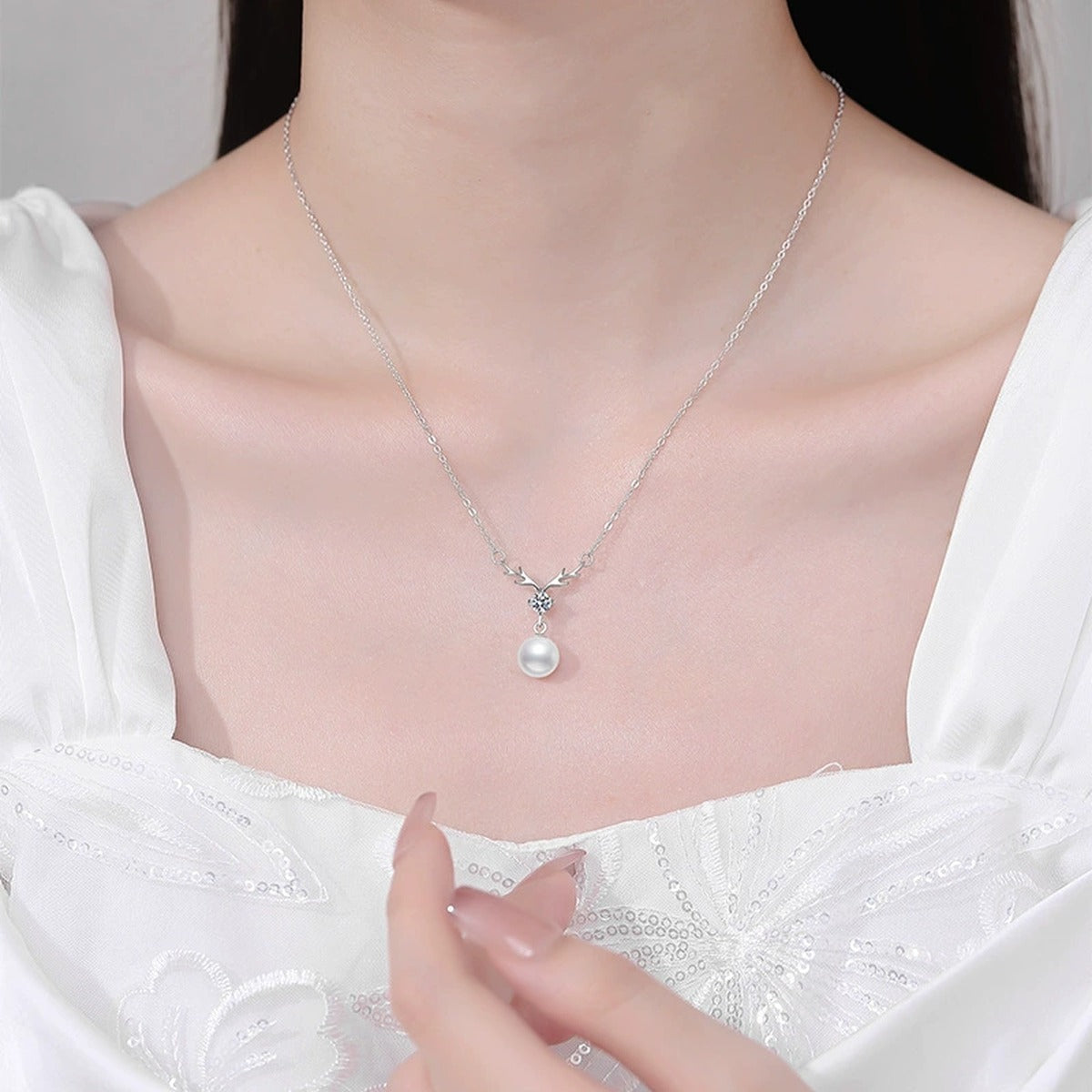 Pearl Antler Moissanite Pendant Necklace in Platinum-Plated S925 Sterling Silver worn on neckline by model