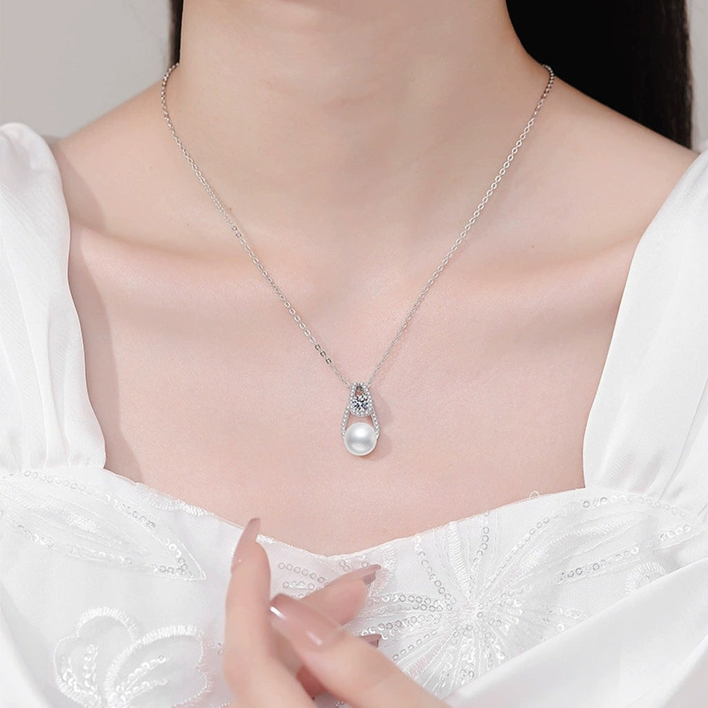 Moissanite Pearl Pendant Necklace with Cubic Zirconia in White Gold-Plated S925 Sterling Silver worn on neckline by model