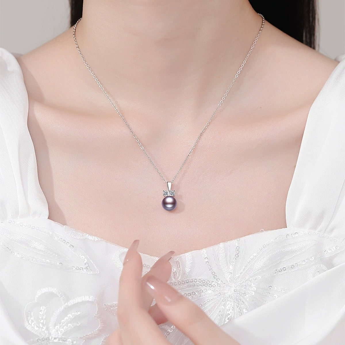 Purple Pearl Moissanite Pendant Necklace in White Gold-Plated S925 Sterling Silver worn on neckline by model
