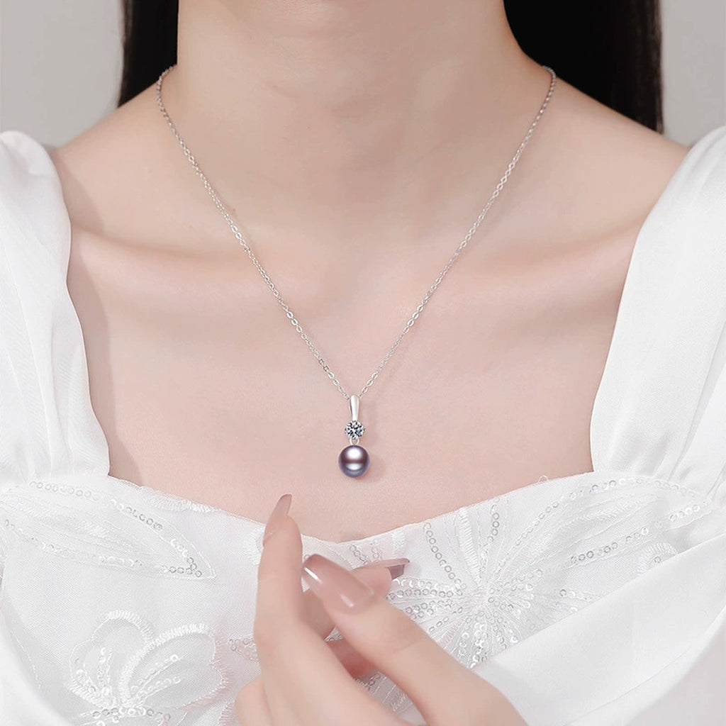 Purple Pearl Moissanite Pendant Necklace in White Gold-Plated S925 Sterling Silver worn on neckline by model