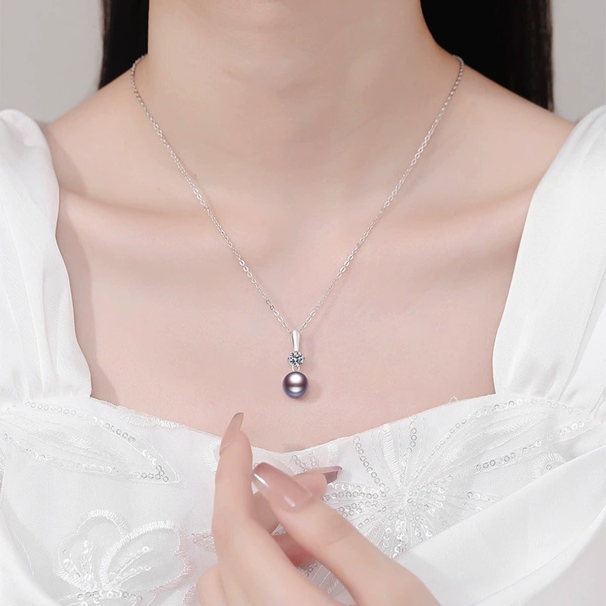 Purple Pearl Moissanite Pendant Necklace in White Gold-Plated S925 Sterling Silver worn on neckline by model