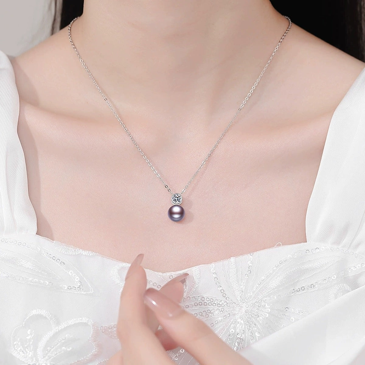 Purple Pearl Moissanite Pendant Necklace in White Gold-Plated S925 Sterling Silver worn on neckline by model