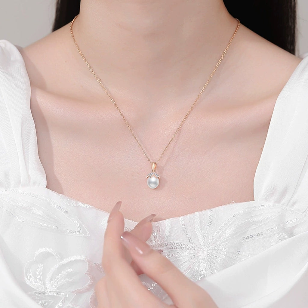 Freshwater Pearl Pendant Necklace with Cubic Zirconia in Gold-Plated S925 Sterling Silver worn on neckline by model