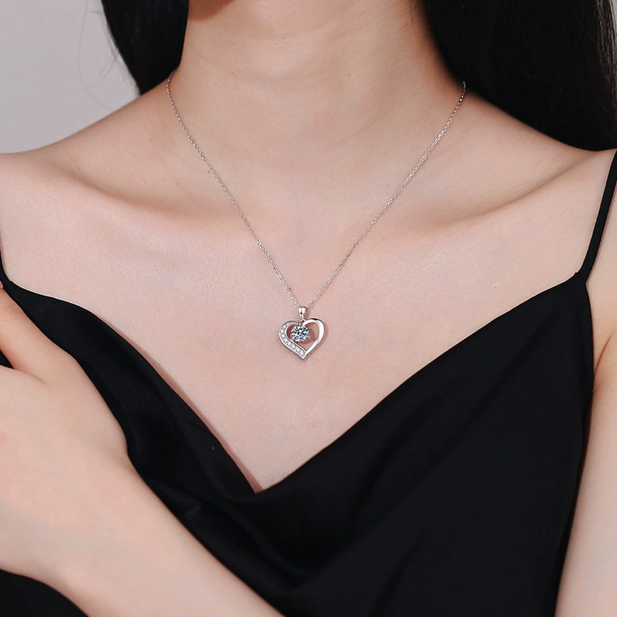 Heart Halo Moissanite Pendant Necklace in Platinum-Plated S925 Sterling Silver worn on neckline by model
