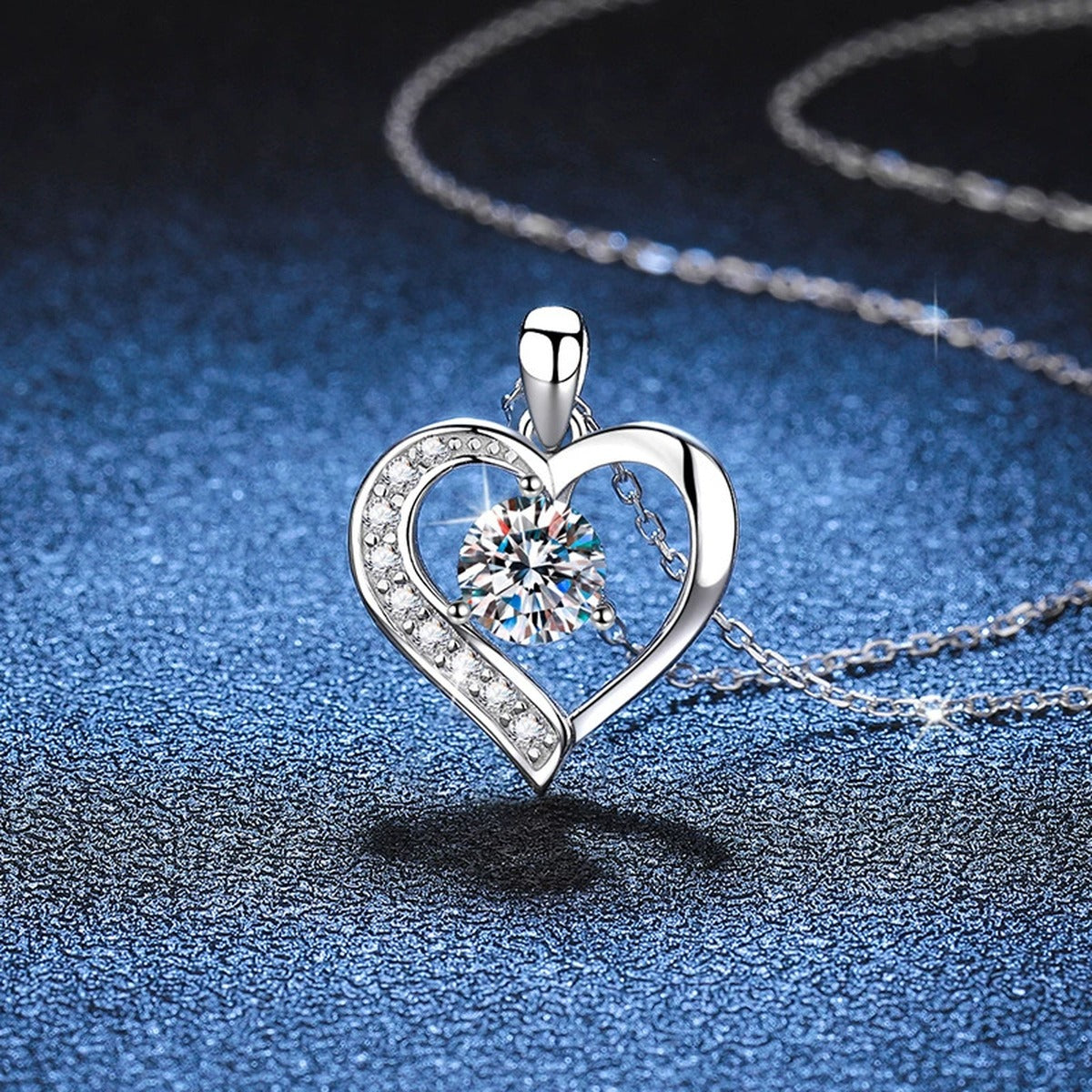 Heart Halo Moissanite Pendant Necklace in Platinum-Plated S925 Sterling Silver blue background close-up view