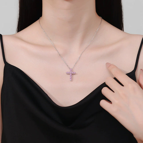 Blue Moissanite Cross Pendant Necklace in Platinum-Plated S925 Sterling Silver worn on neckline by model