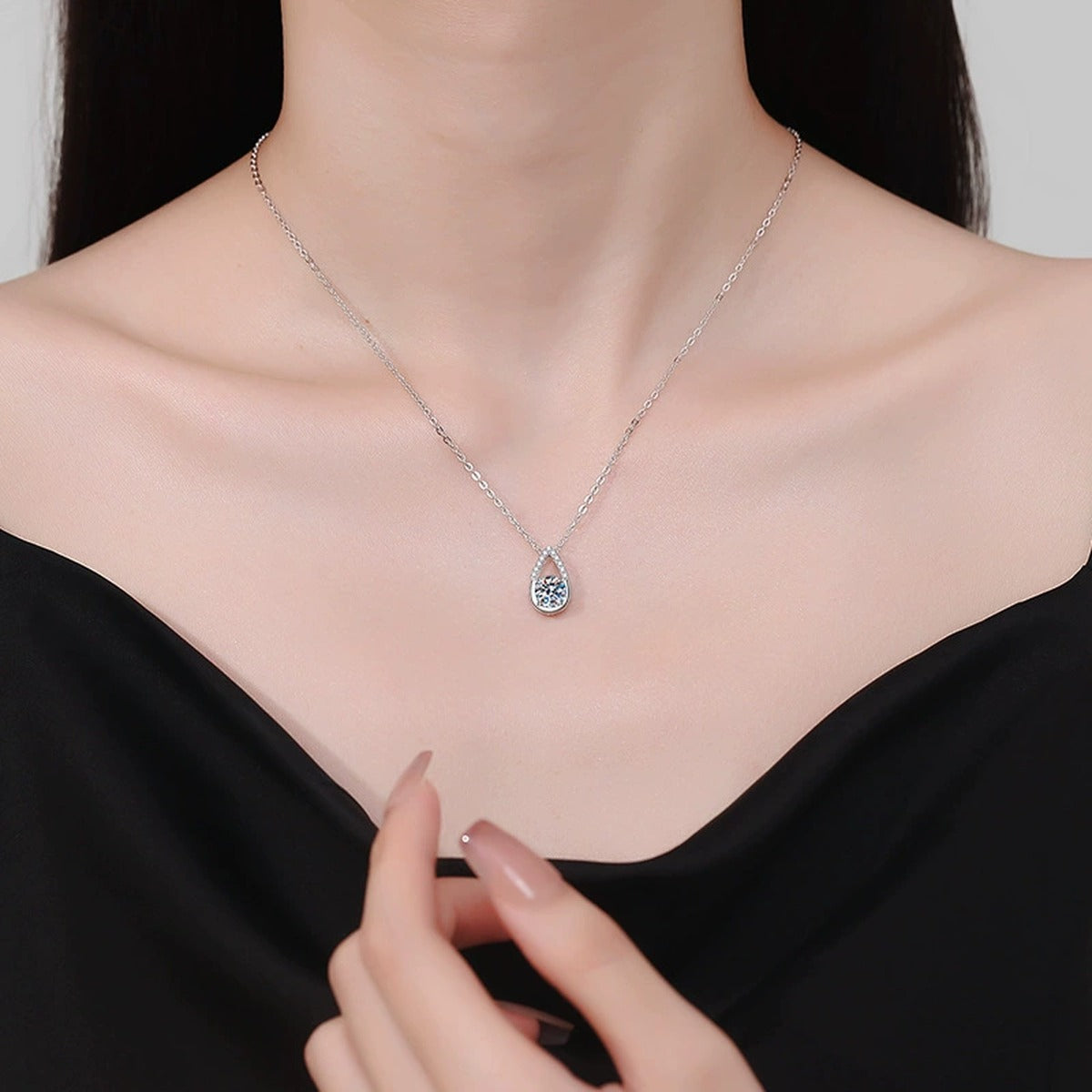 Teardrop Moissanite Pendant Necklace in Platinum-Plated S925 Sterling Silver worn on neckline by model