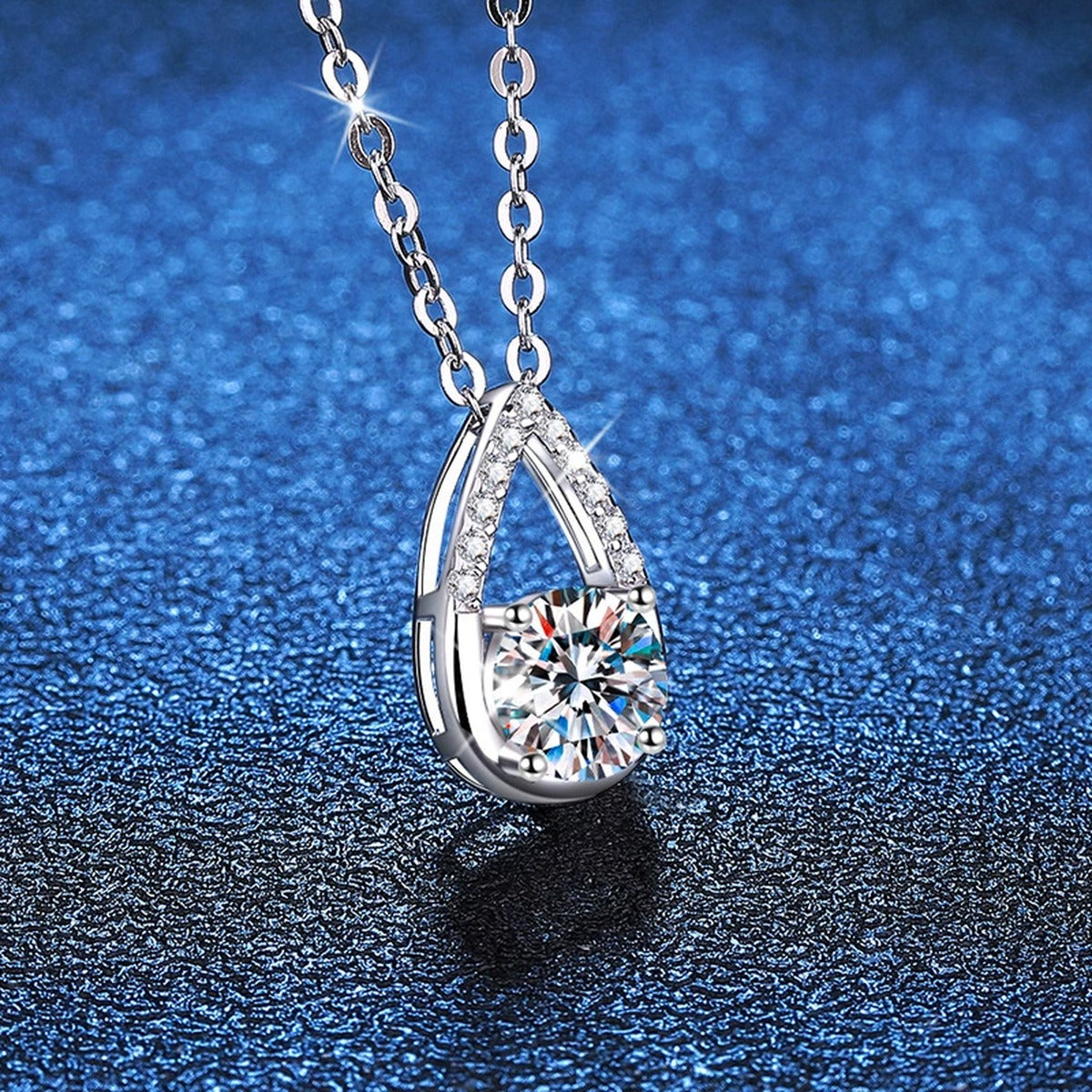 Teardrop Moissanite Pendant Necklace in Platinum-Plated S925 Sterling Silver blue background product view