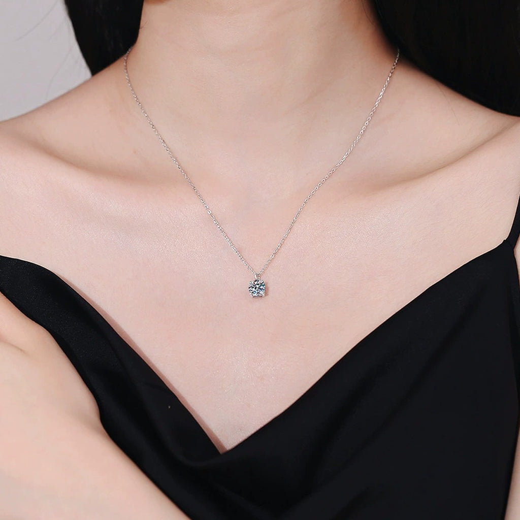 Round Solitaire Moissanite Pendant Necklace in Platinum-Plated S925 Sterling Silver worn on neckline by model