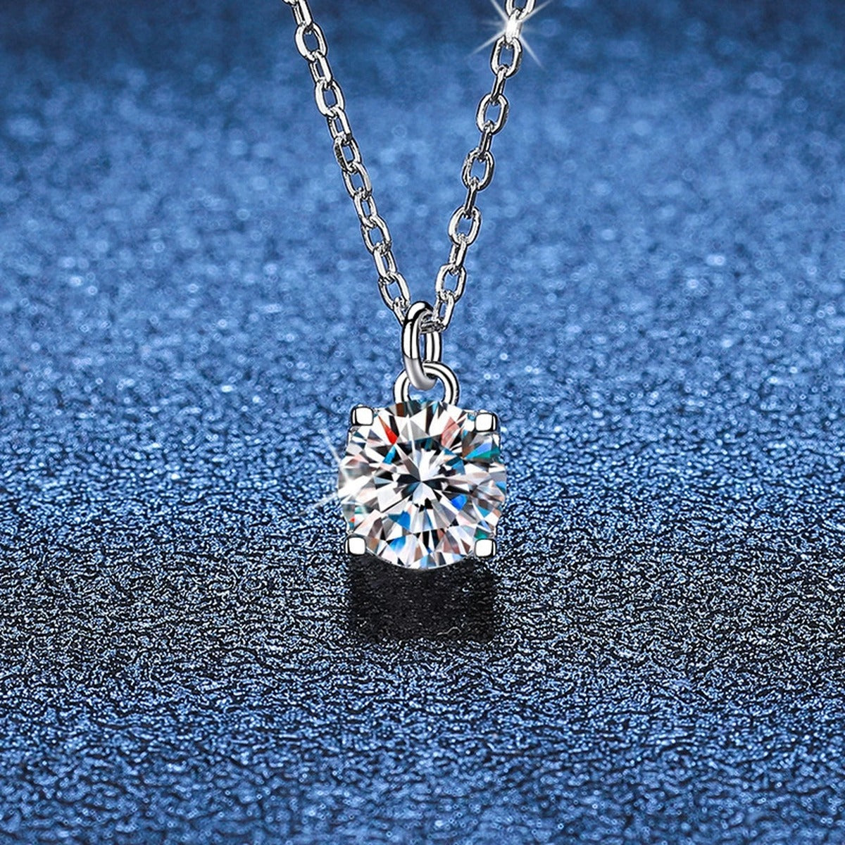 Round Solitaire Moissanite Pendant Necklace in Platinum-Plated S925 Sterling Silver blue background product view