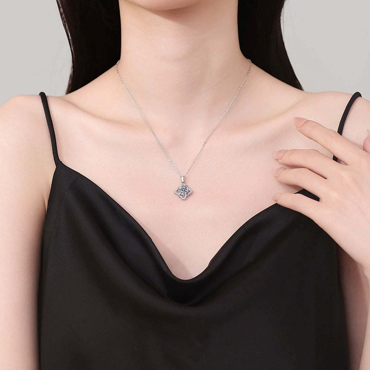 Quatrefoil Halo Moissanite Pendant Necklace in Platinum-Plated S925 Sterling Silver worn on neckline by model