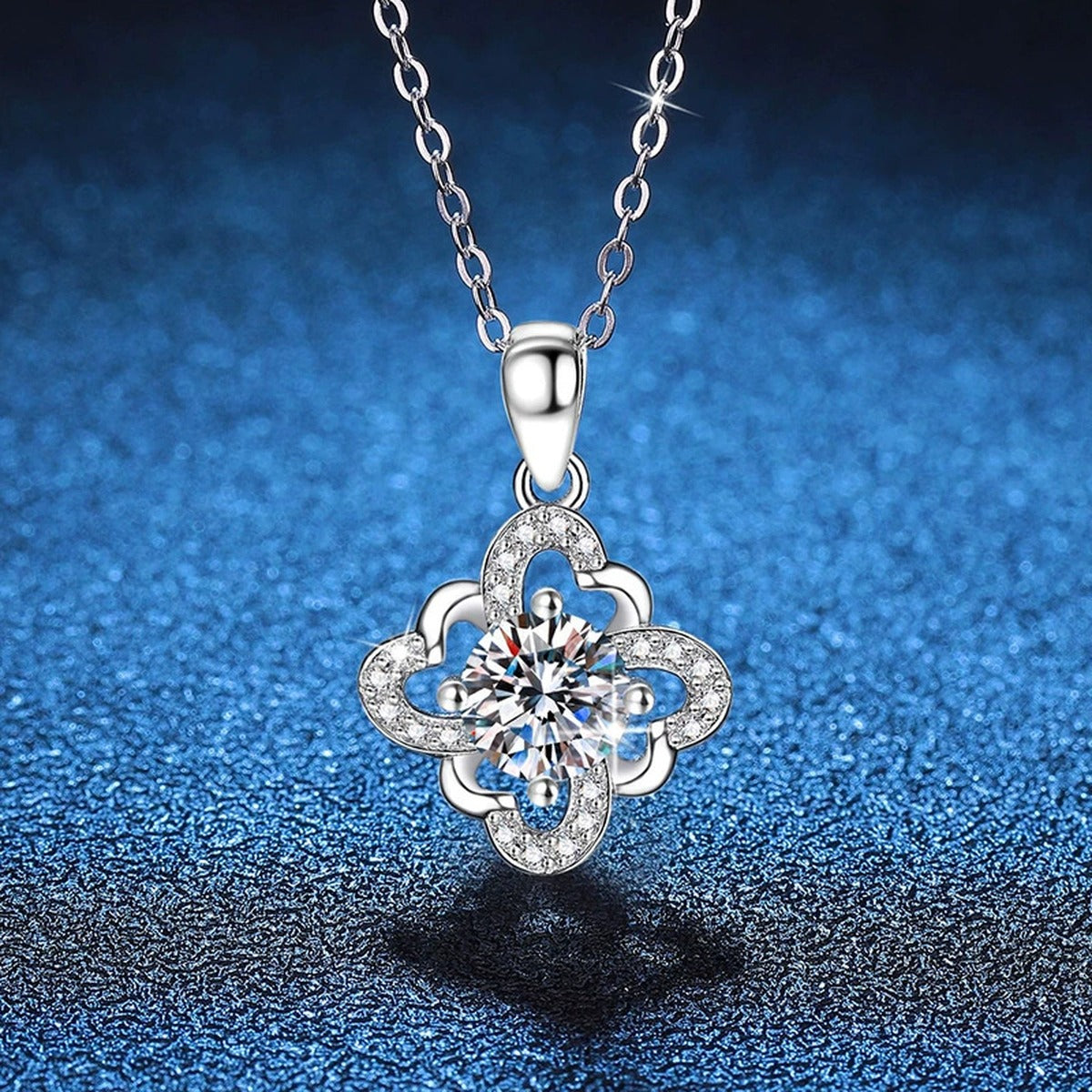 Quatrefoil Halo Moissanite Pendant Necklace in Platinum-Plated S925 Sterling Silver blue background product view
