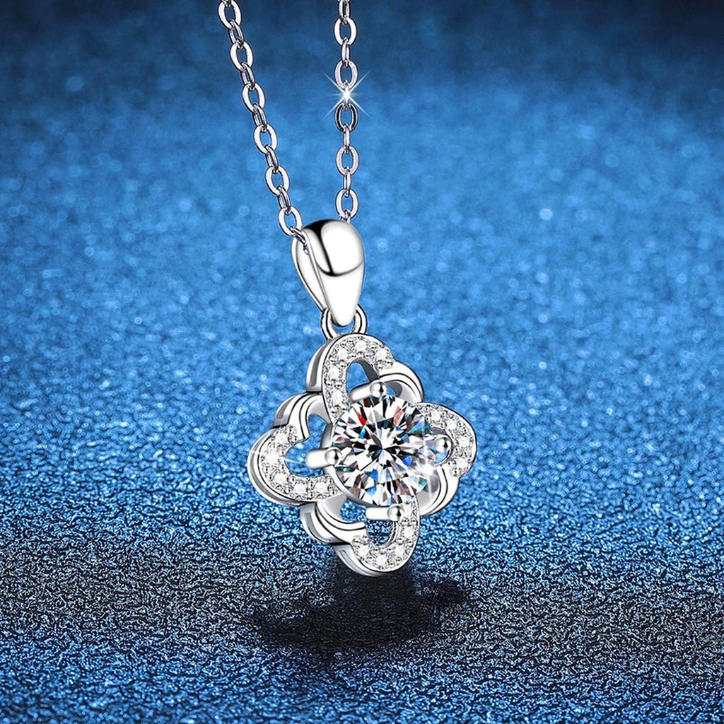Quatrefoil Halo Moissanite Pendant Necklace in Platinum-Plated S925 Sterling Silver blue background close-up view
