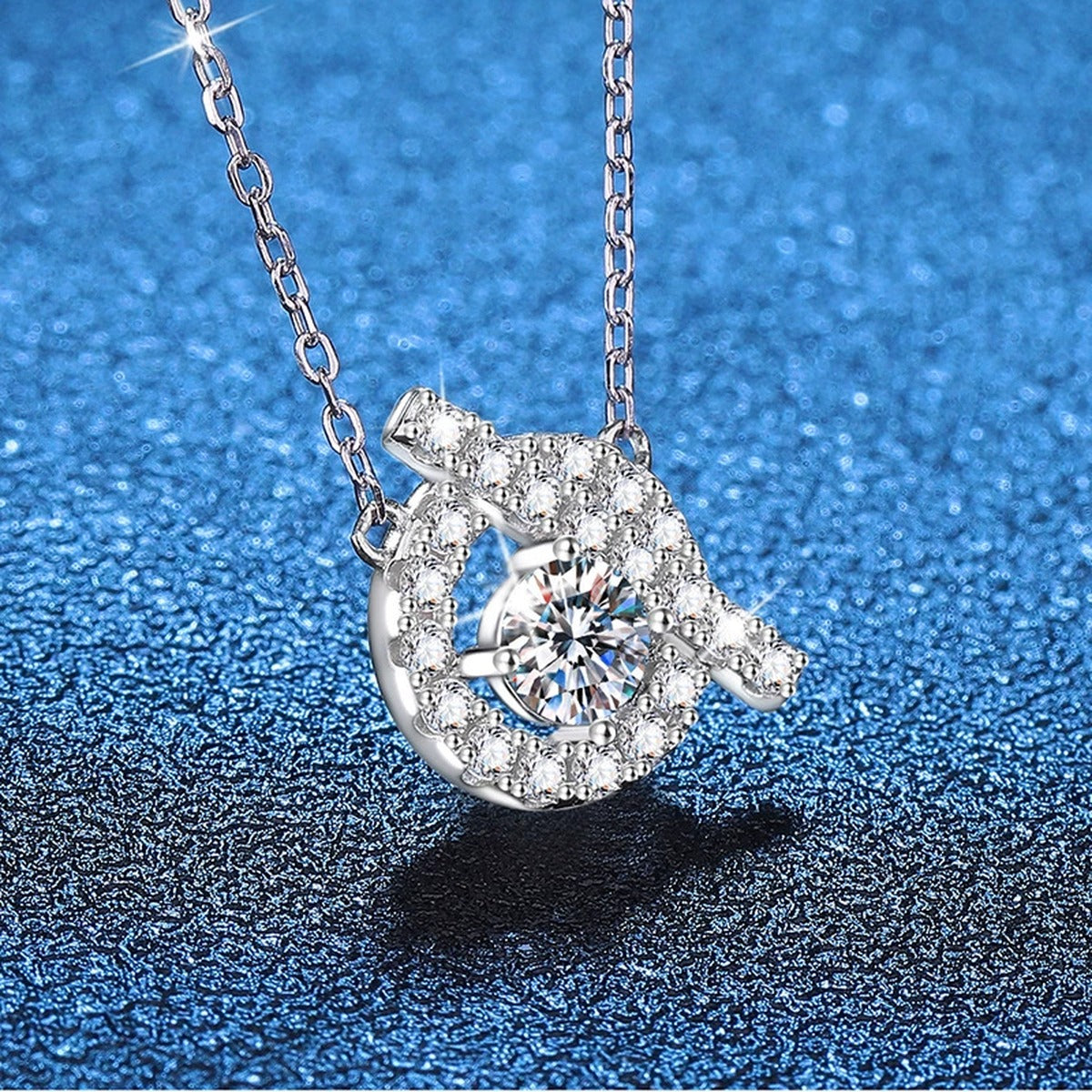 Swirl Halo Moissanite Pendant Necklace in Platinum-Plated S925 Sterling Silver blue background angled view