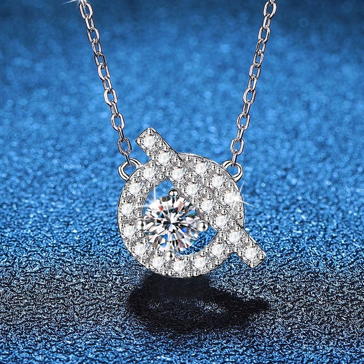 Swirl Halo Moissanite Pendant Necklace in Platinum-Plated S925 Sterling Silver blue background close-up view