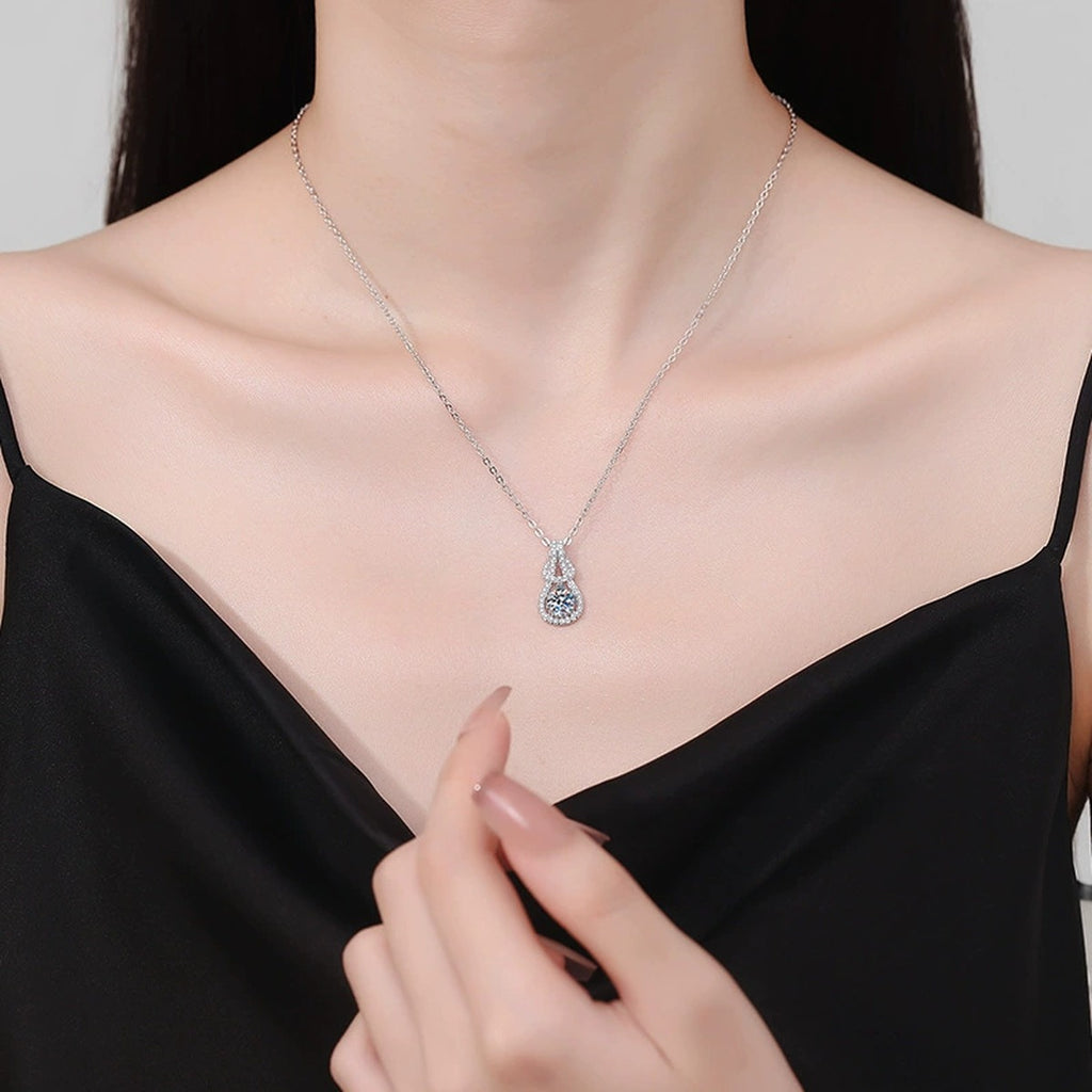 Pave Teardrop Moissanite Pendant Necklace in Platinum-Plated S925 Sterling Silver worn on neckline by model