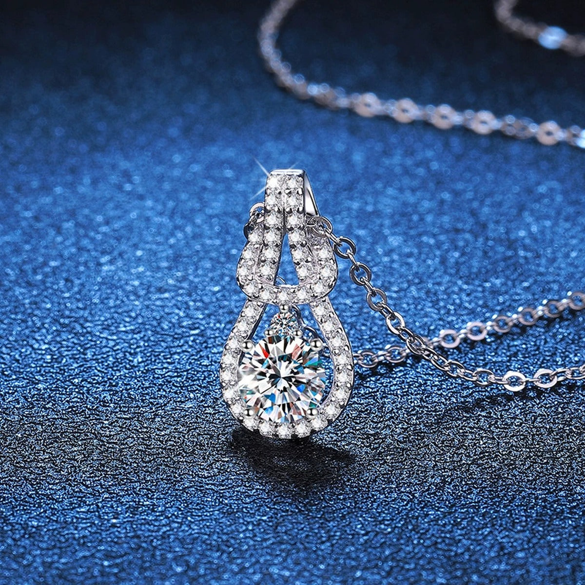 Pave Teardrop Moissanite Pendant Necklace in Platinum-Plated S925 Sterling Silver blue background product view
