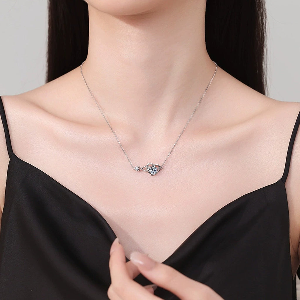 Infinity Heart Moissanite Station Necklace in Platinum-Plated S925 Sterling Silver worn on neckline by model
