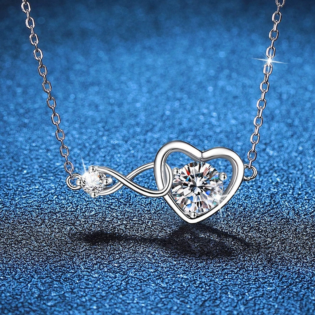 Infinity Heart Moissanite Station Necklace in Platinum-Plated S925 Sterling Silver blue background close-up view