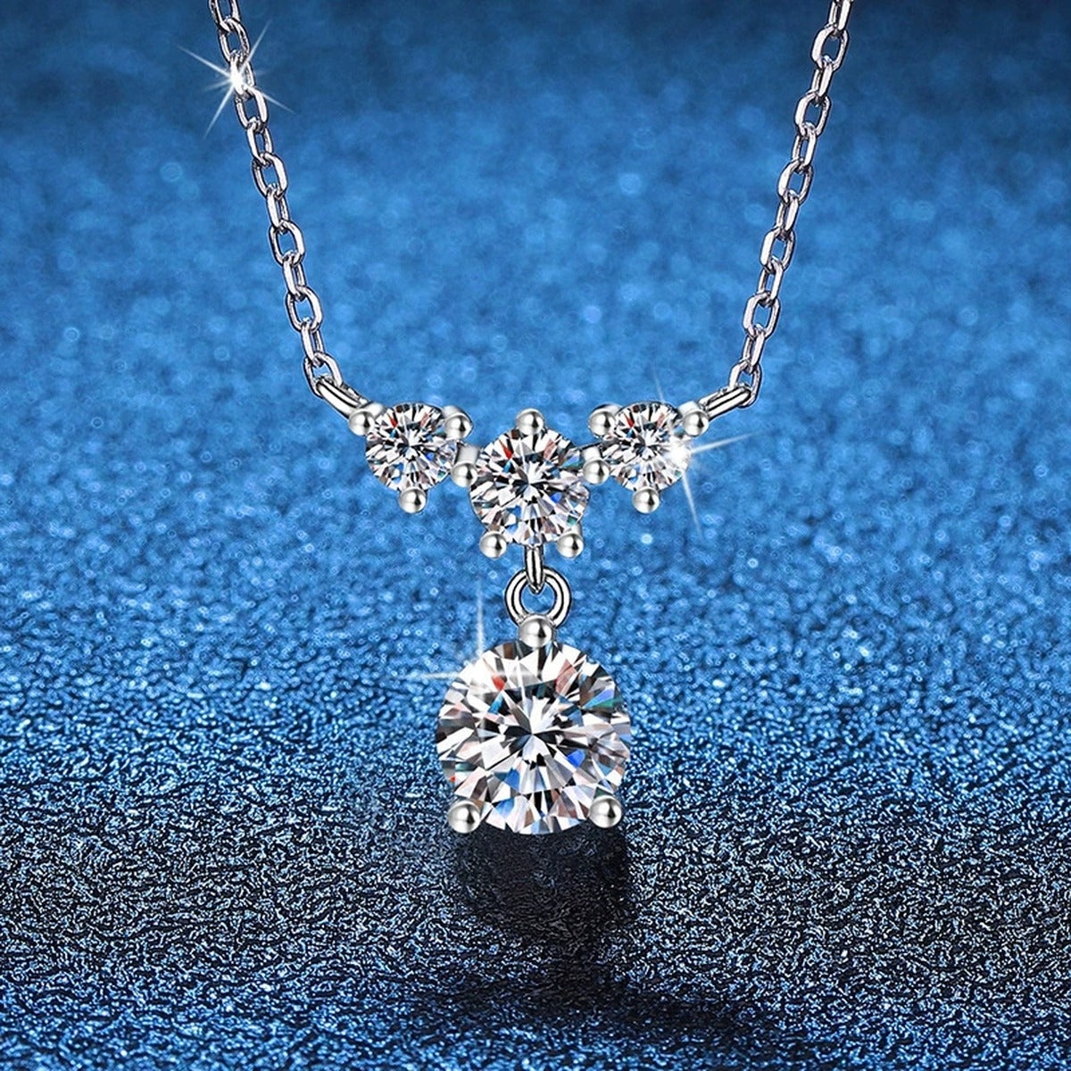Bow Drop Moissanite Pendant Necklace in Platinum-Plated S925 Sterling Silver blue background product view