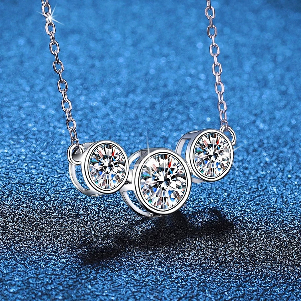 Three-Stone Moissanite Station Necklace in Platinum-Plated S925 Sterling Silver blue background product view