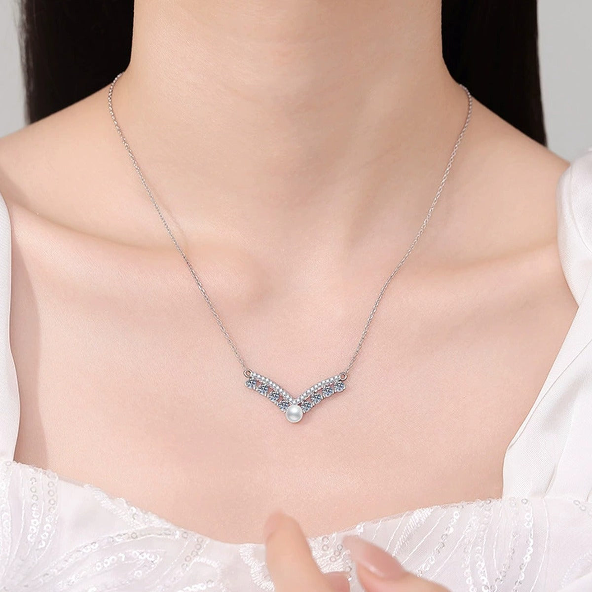 Moissanite Pearl Pendant Necklace with Cubic Zirconia in White Gold-Plated S925 Sterling Silver worn on neckline by model