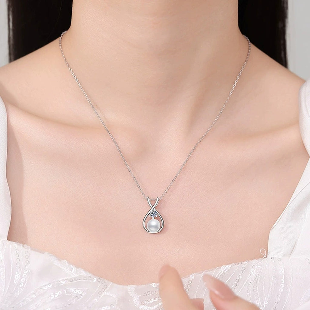 Moissanite Pearl Pendant Necklace in White Gold-Plated S925 Sterling Silver worn on neckline by model