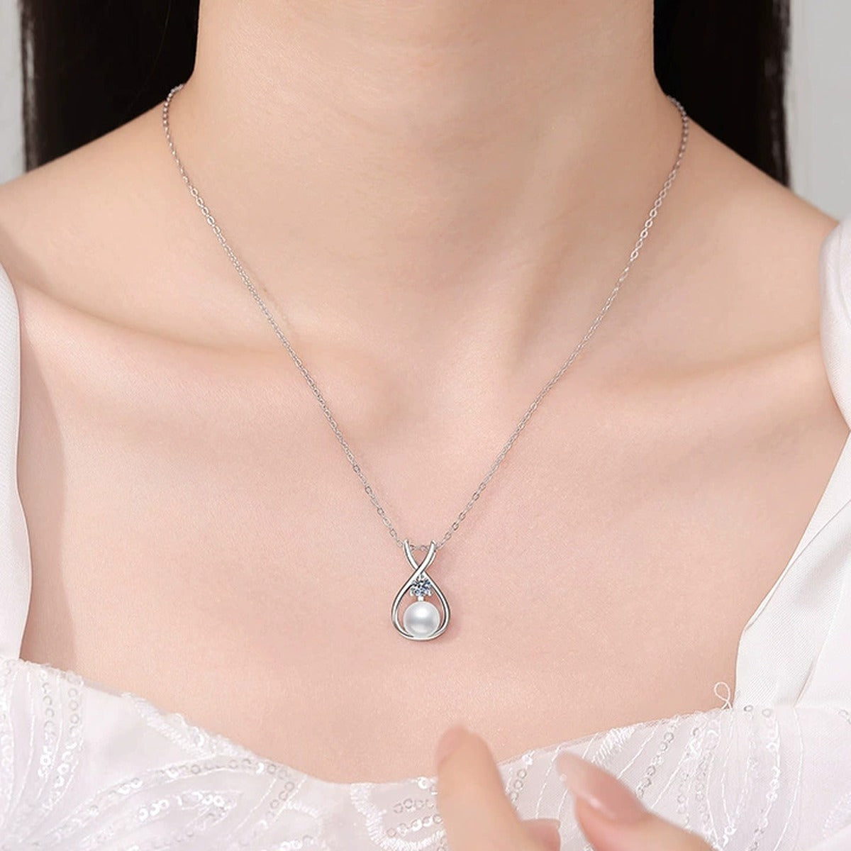 Moissanite Pearl Pendant Necklace in White Gold-Plated S925 Sterling Silver worn on neckline by model