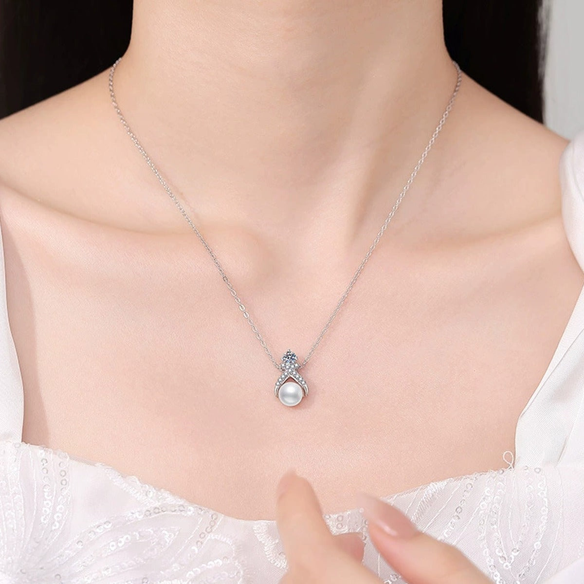 Moissanite Pearl Pendant Necklace with Cubic Zirconia in White Gold-Plated S925 Sterling Silver worn on neckline by model