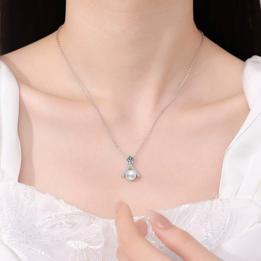 Moissanite Pearl Pendant Necklace with Cubic Zirconia in White Gold-Plated S925 Sterling Silver worn on neckline by model