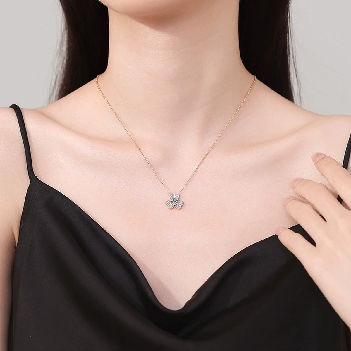 Four-Leaf Clover Moissanite Pendant Necklace in Champagne Gold-Plated S925 Sterling Silver worn on neckline by model