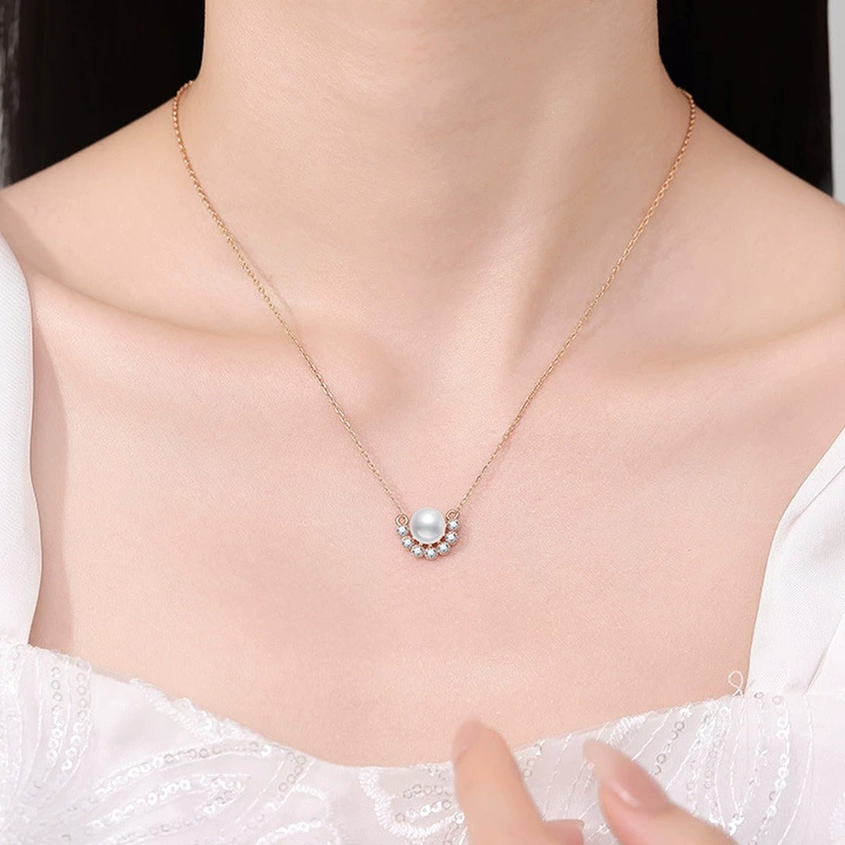 Curved Moissanite Freshwater Pearl Pendant Necklace in White Gold-Plated S925 Sterling Silver worn on neckline by model