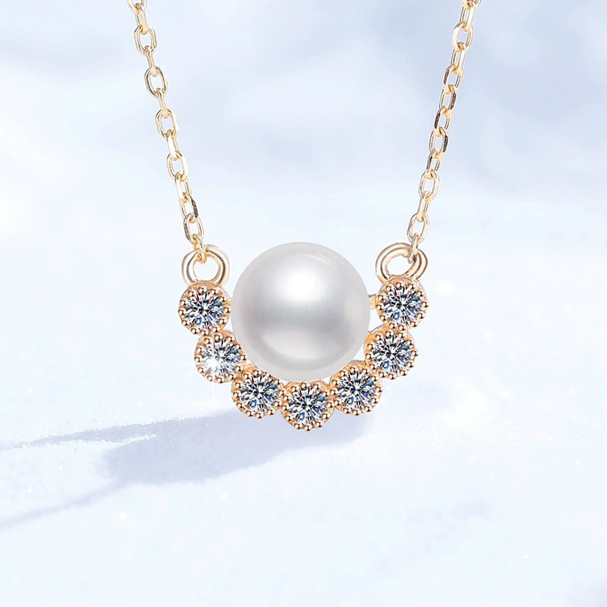 Curved Moissanite Freshwater Pearl Pendant Necklace in White Gold-Plated S925 Sterling Silver on clean white background showing the curved pendant with a freshwater pearl and lower arc of moissanite detail