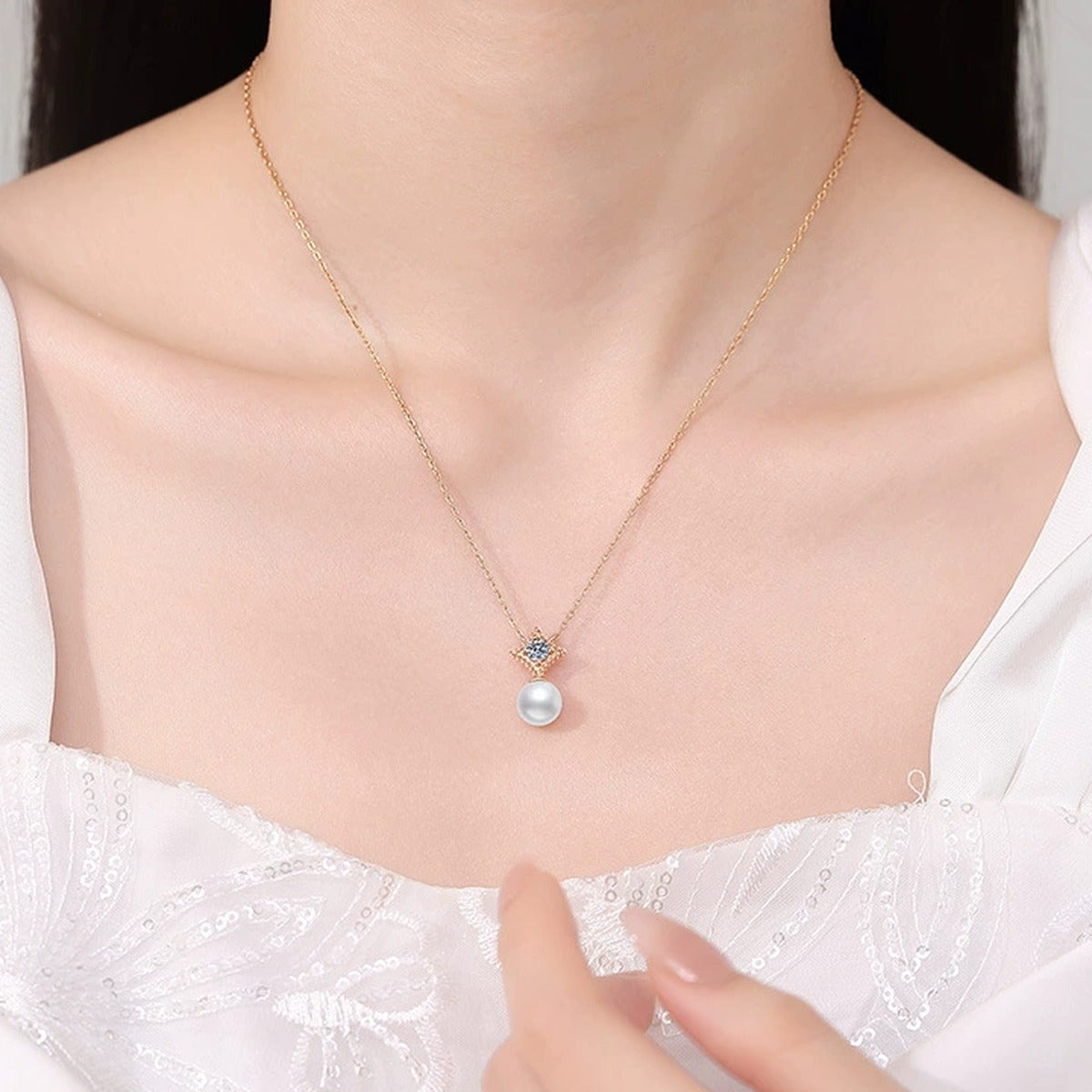 Starburst Moissanite Freshwater Pearl Pendant Necklace in White Gold-Plated S925 Sterling Silver worn on neckline by model
