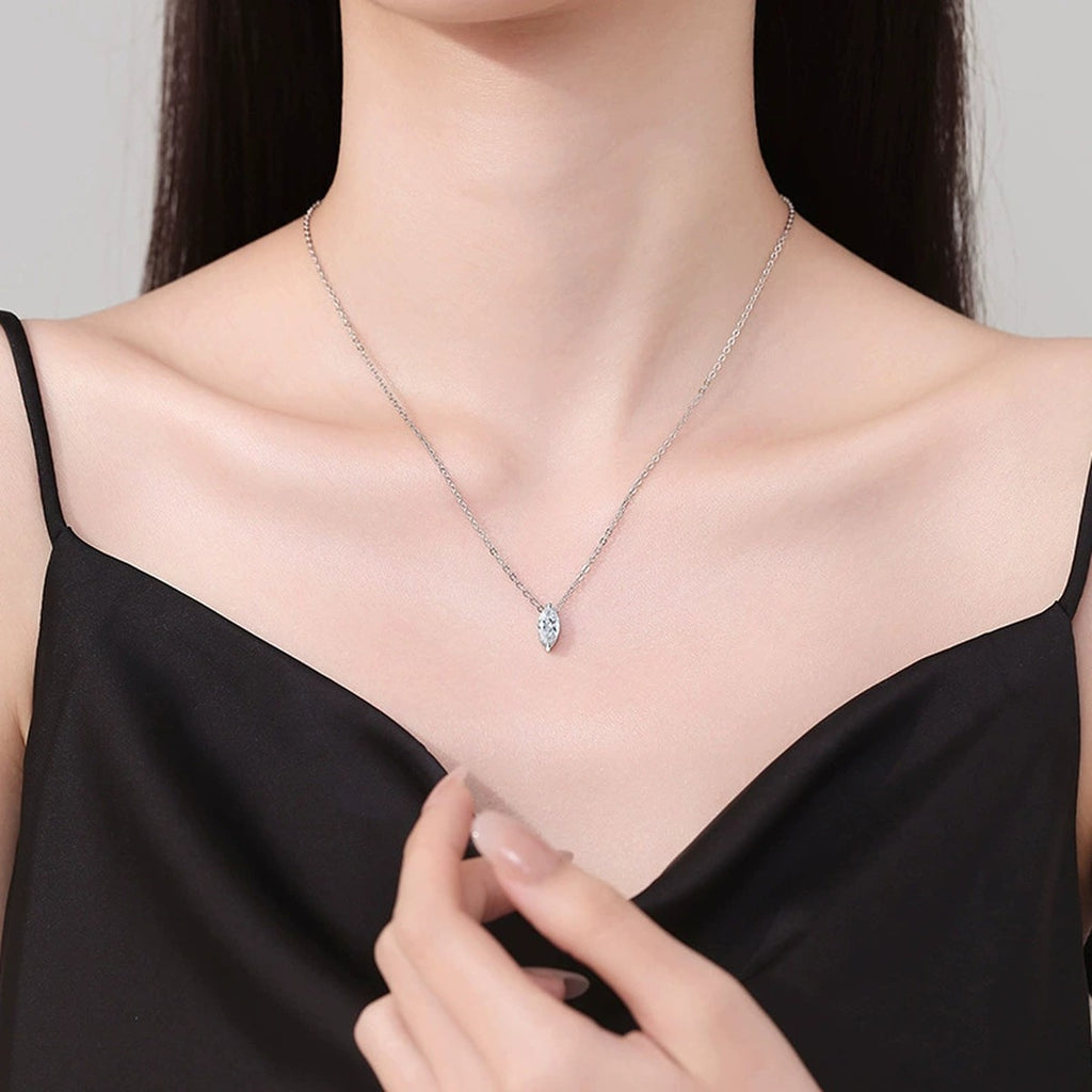 Marquise Moissanite Pendant Necklace in Platinum-Plated S925 Sterling Silver worn on neckline by model