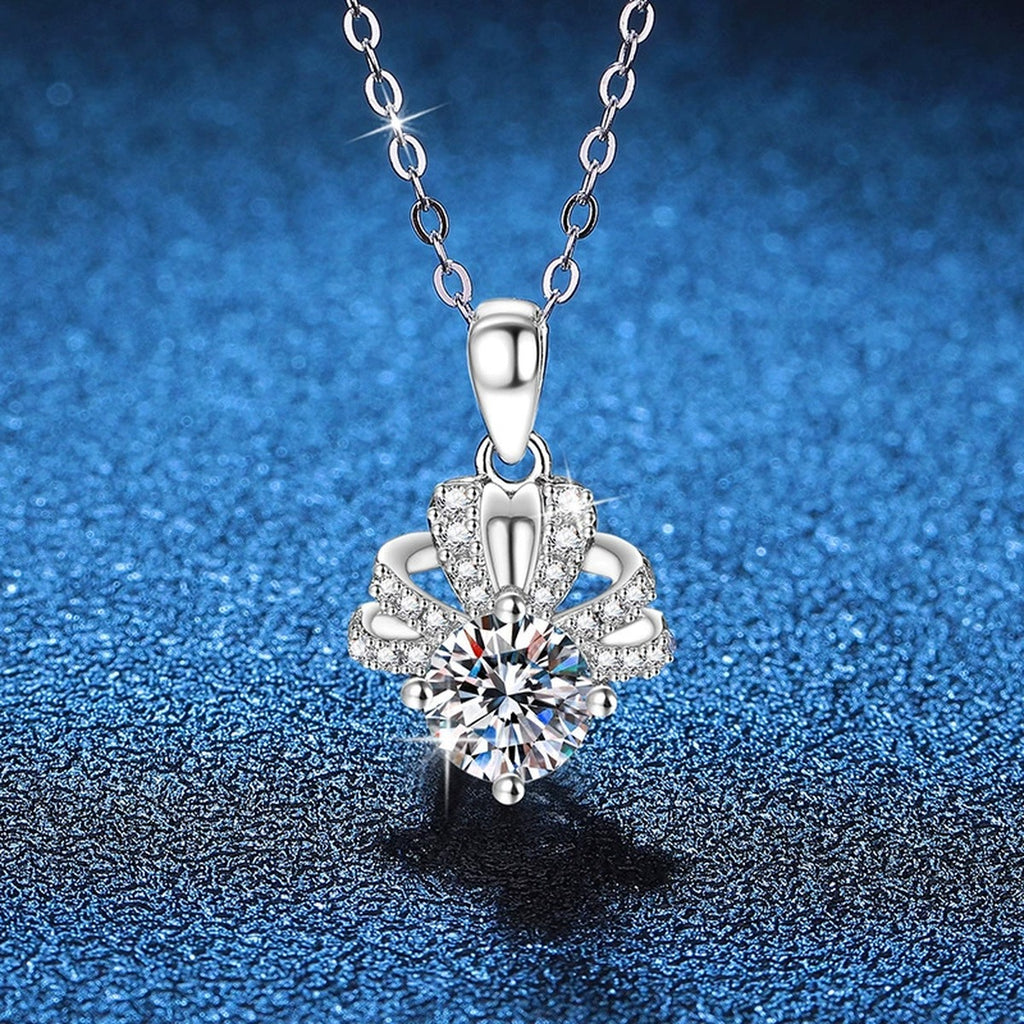 Floral Halo Moissanite Pendant Necklace in Platinum-Plated S925 Sterling Silver blue background angled view