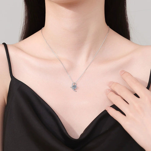 Crescent Moon Moissanite Pendant Necklace in Platinum-Plated S925 Sterling Silver worn on neckline by model