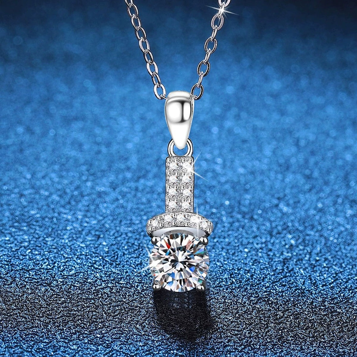 Pave Bar Moissanite Pendant Necklace in Platinum-Plated S925 Sterling Silver blue background angled view
