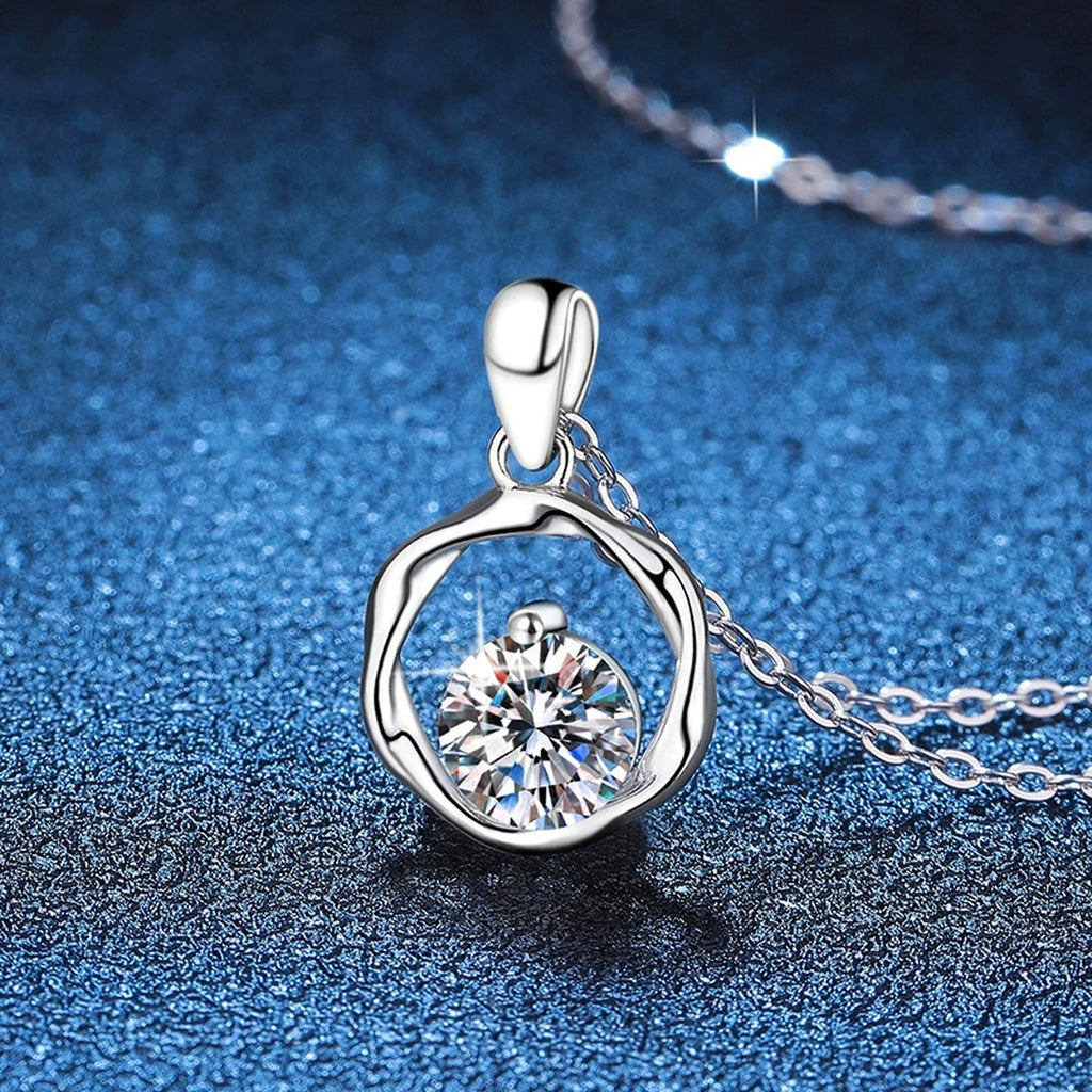Organic Circle Moissanite Pendant Necklace in Platinum-Plated S925 Sterling Silver blue background angled view