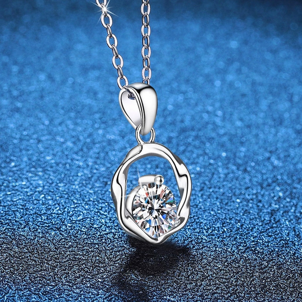 Organic Circle Moissanite Pendant Necklace in Platinum-Plated S925 Sterling Silver blue background close-up view