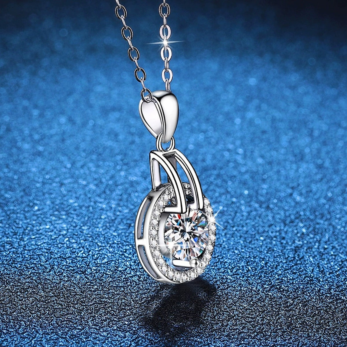 Round Halo Frame Moissanite Pendant Necklace in Platinum-Plated S925 Sterling Silver blue background angled view