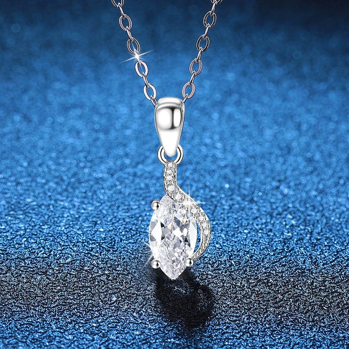 Marquise Teardrop Moissanite Pendant Necklace in Platinum-Plated S925 Sterling Silver blue background close-up view