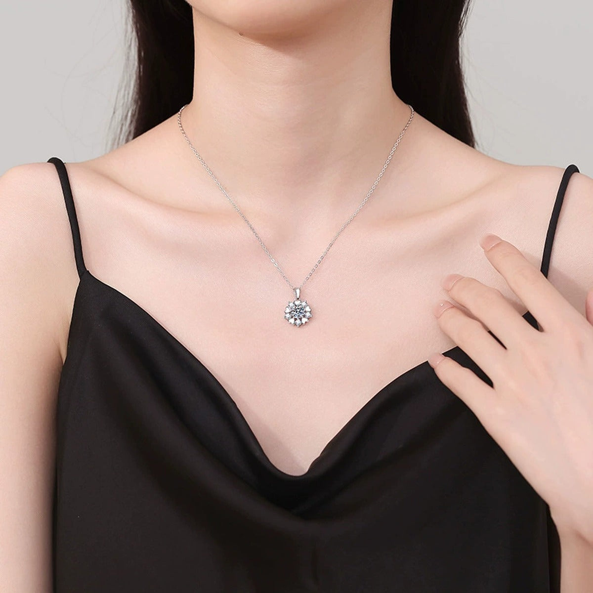 Floral Starburst Moissanite Pendant Necklace in Platinum-Plated S925 Sterling Silver worn on neckline by model