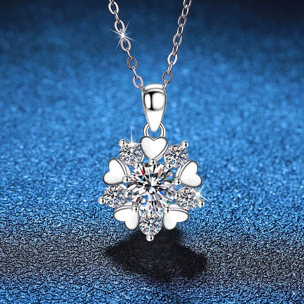 Floral Starburst Moissanite Pendant Necklace in Platinum-Plated S925 Sterling Silver blue background angled view