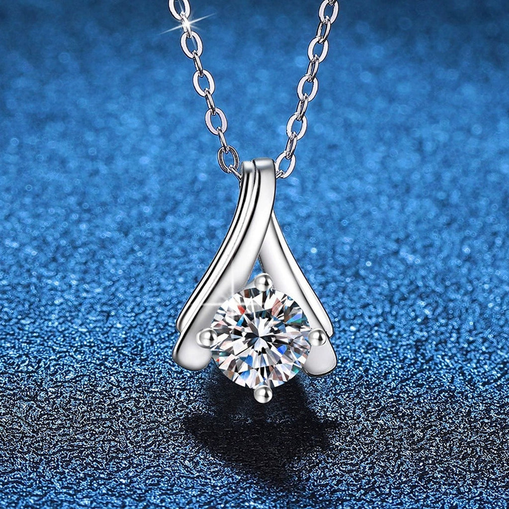 Teardrop Solitaire Moissanite Pendant Necklace in Platinum-Plated S925 Sterling Silver blue background product view