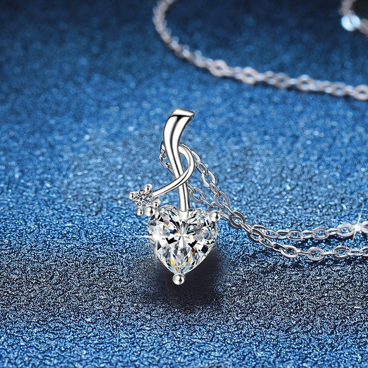 Heart Twist Moissanite Pendant Necklace in Platinum-Plated S925 Sterling Silver blue background angled view