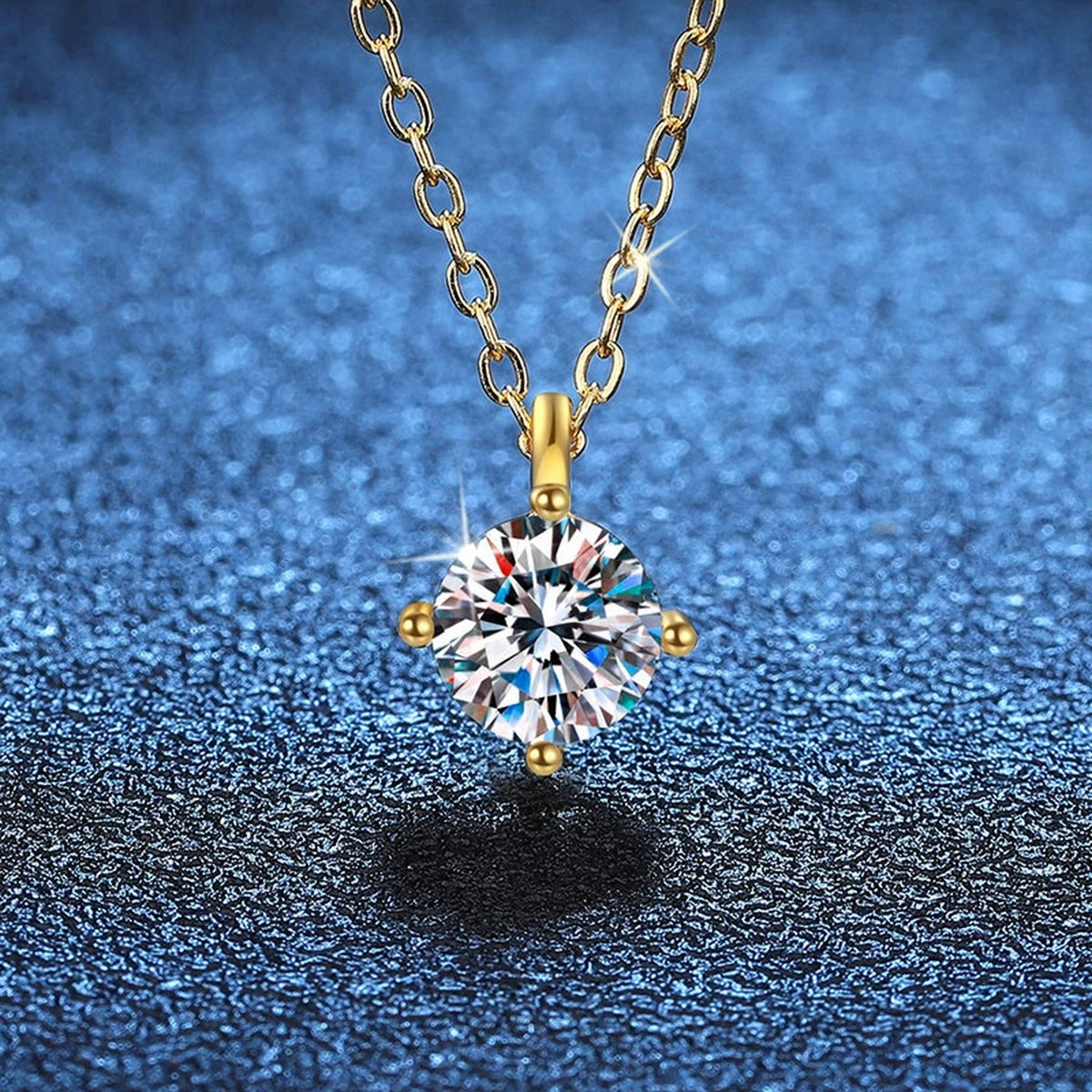 Round Solitaire Moissanite Pendant Necklace in Gold-Plated S925 Sterling Silver blue background angled view