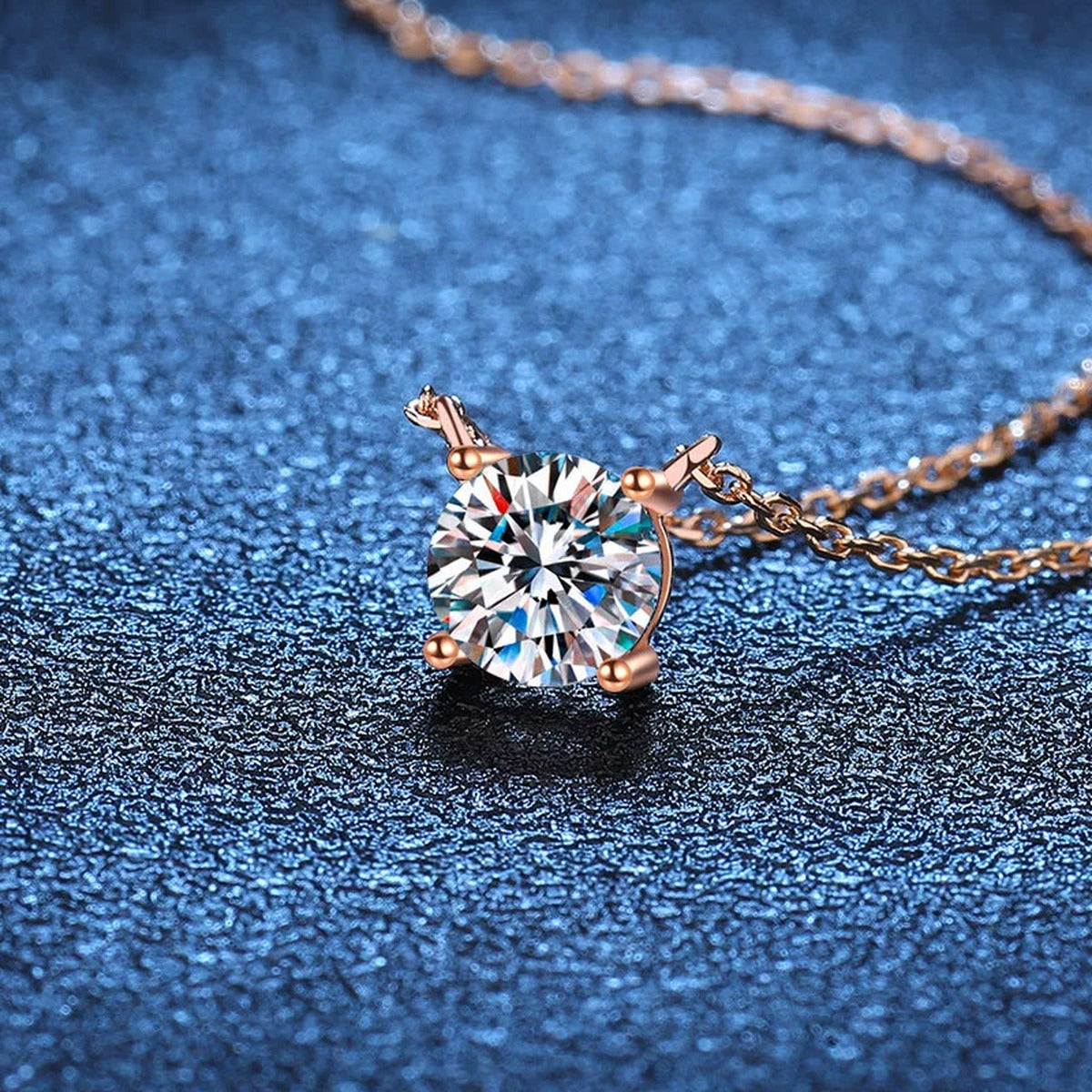 Round Solitaire Moissanite Pendant Necklace in 18K Yellow Gold-Plated S925 Sterling Silver blue background angled view